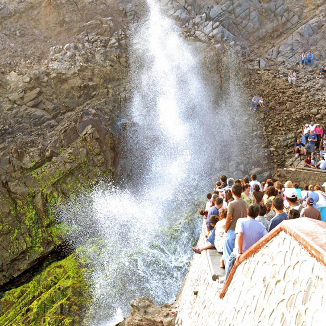Tourists experiencing the famous blowhole in Ensenada, Mexico, La Bufadora, during a private $120 guided tour.