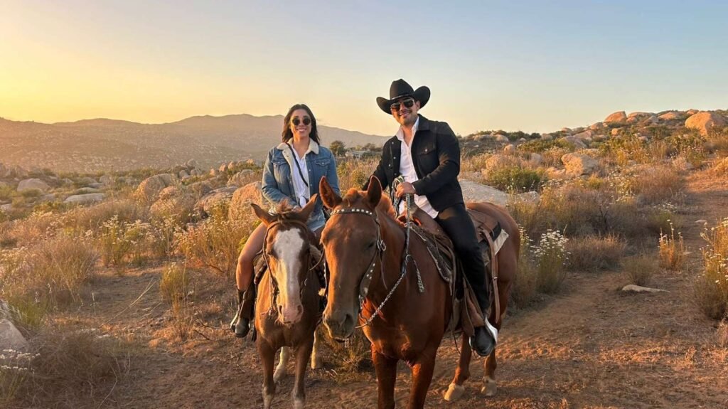 Adventure horseback riding tour through Baja California vineyard landscape in Valle de Guadalupe Mexico