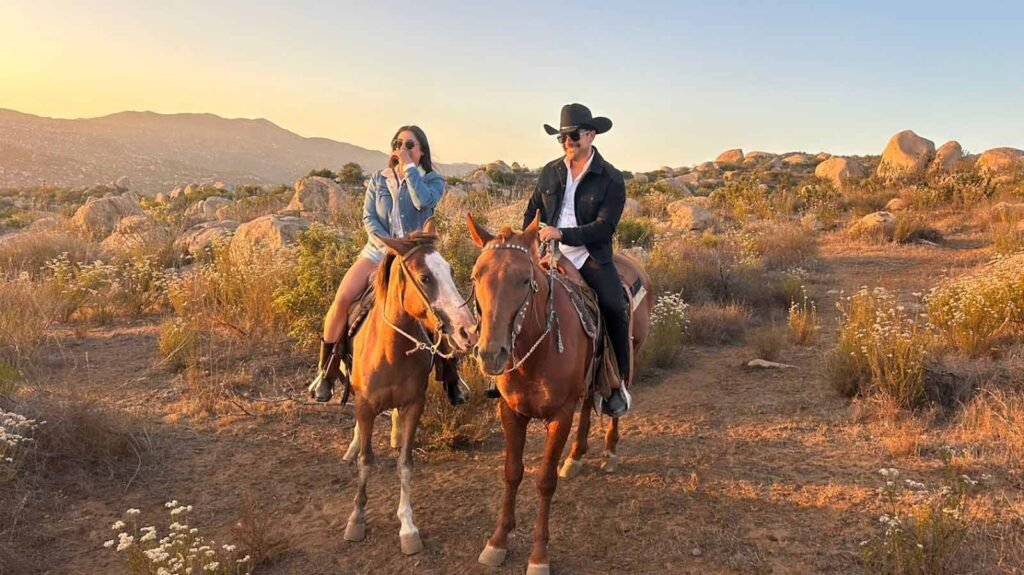 Guests on horseback riding through Valle de Guadalupe wine country trails with Red Wine Tours in Baja